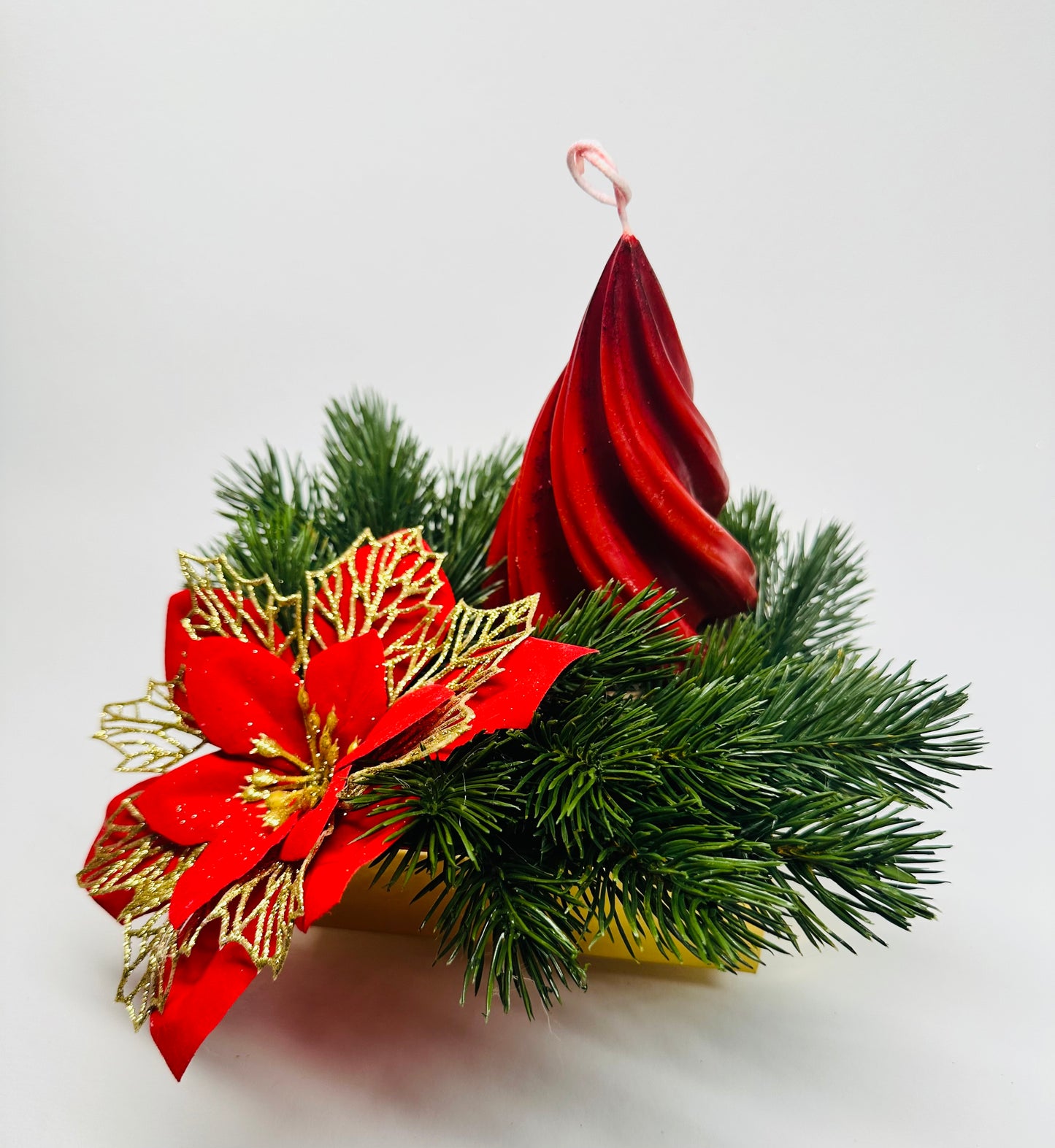 Centre de table de Noël avec bougie et poinsettia