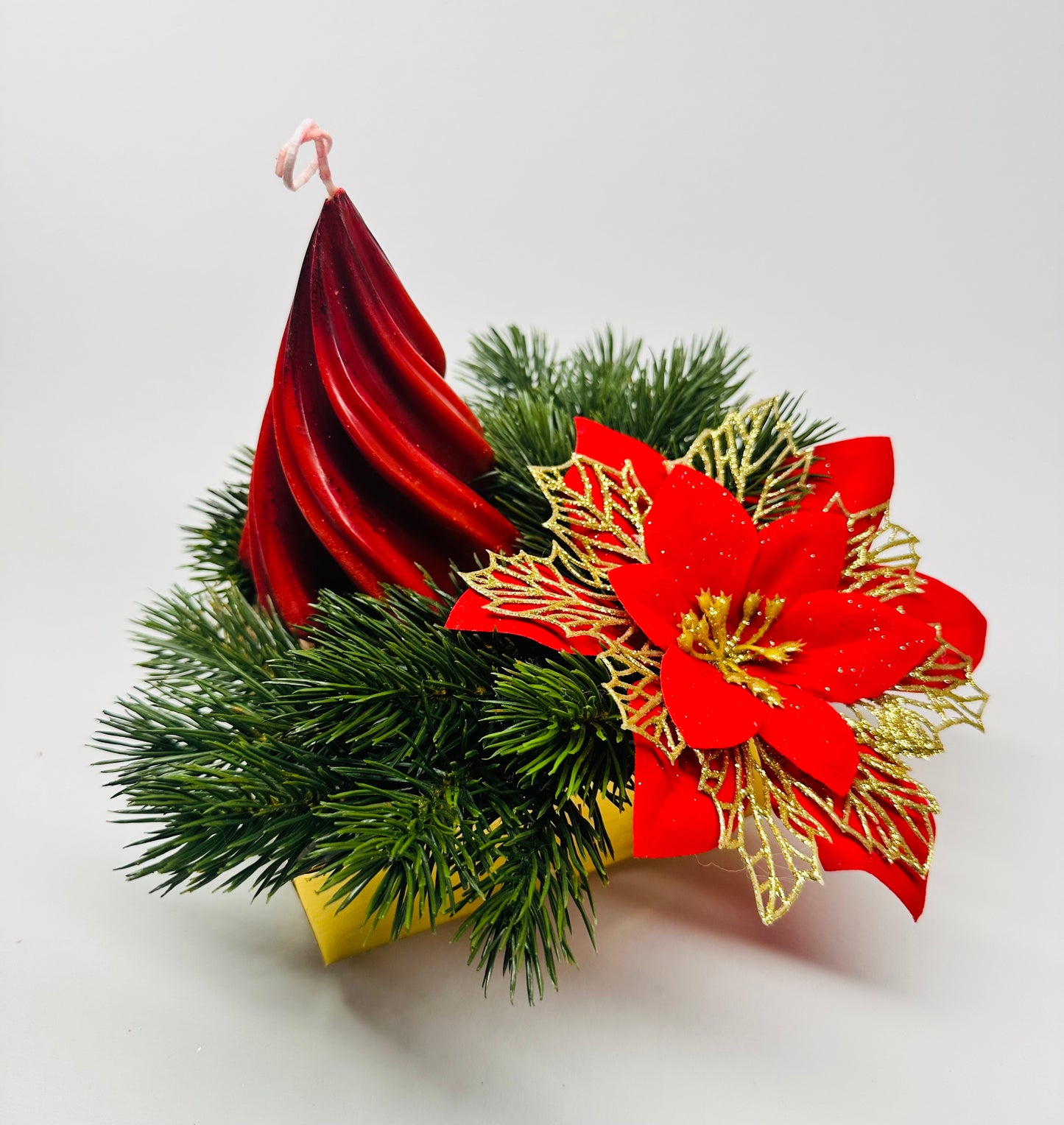 Centre de table de Noël avec bougie et poinsettia